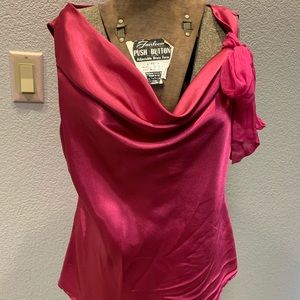 Bright Pink sleeveless blouse.